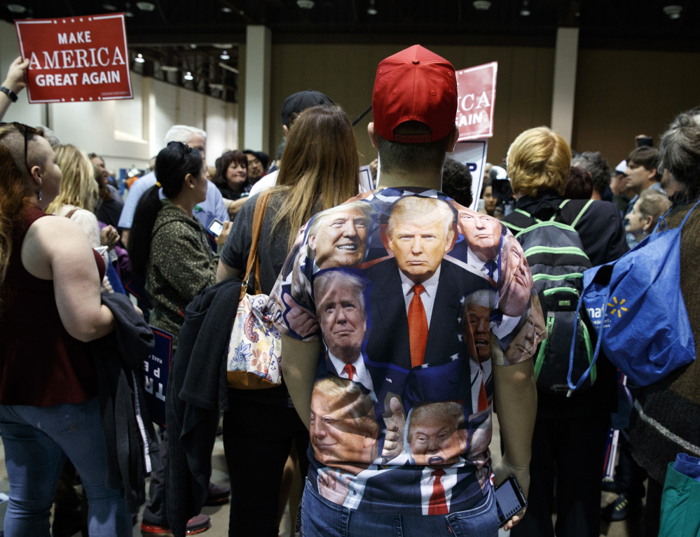 Donald Trump's supporters hear the Republican presidential nominee heap praise on running mate Mike Pence during a campaign stop Wednesday in Nevada.