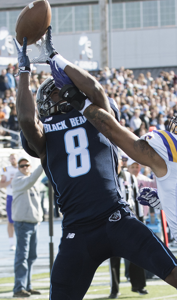 Jaleel Reed has his reception broken up by Albany's Julian Cox late in the first half last  Saturday in Orono.