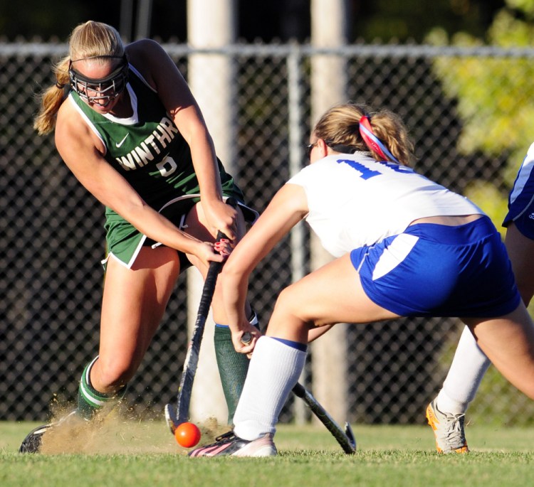 Winthrop's Sarah Spahr, left, and Oak Hill's Lindsey Wright battle for a ball during a game Wednesday in Litchfield.