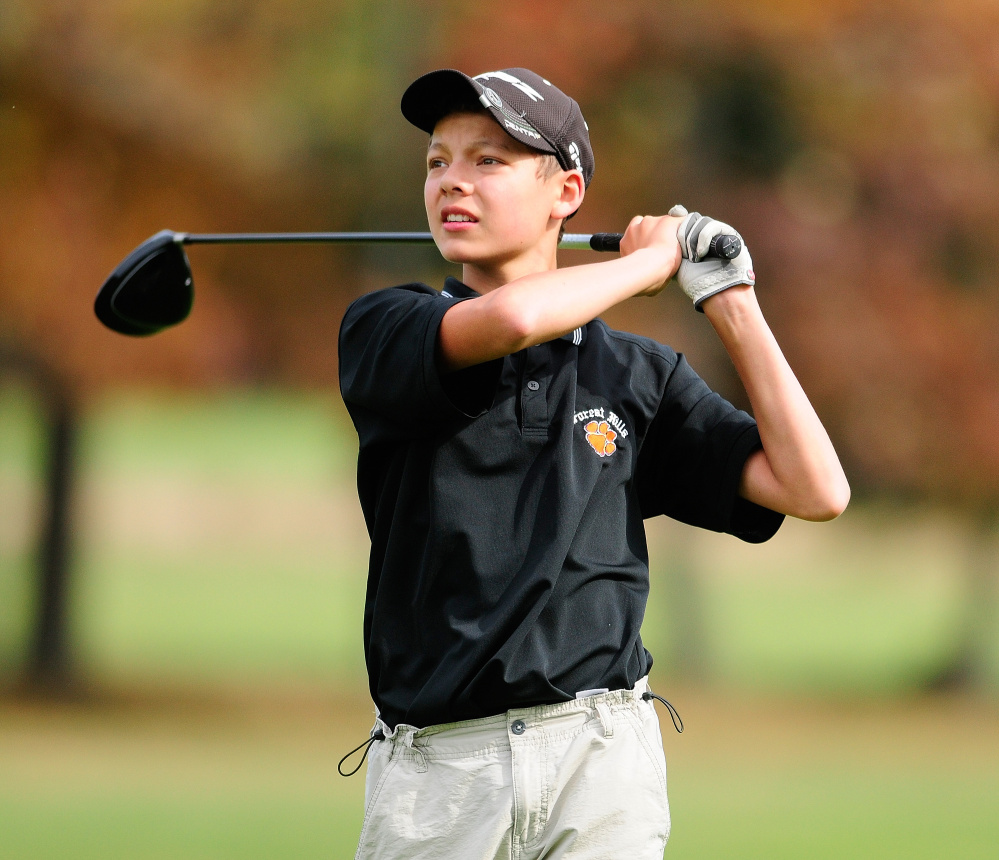 Staff photo by Joe Phelan 
 Forest Hills golfer Quentin Rodriguez watches his shot on the ninth fairway of the Arrowhead course during the state team golf championship on Saturday at Natanis Golf Course in Vassalboro.