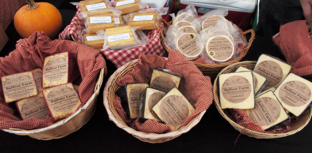 Cheeses made at the Balfour farm in Pittsfield await farm visitors during Open Creamery Day on Sunday.