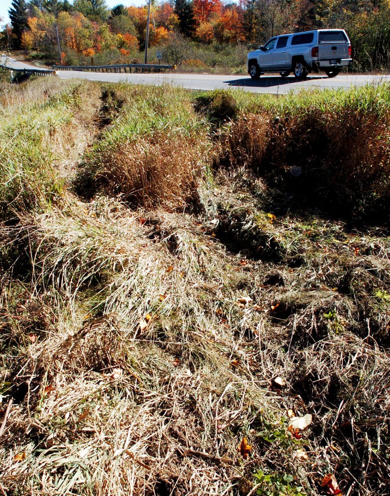 Traffic travels on Shadagee Road in Cornville past the tire marks where driver from Madison went off the road Sunday night and was killed when the truck flipped over and landed on Rowell Mountain Road.