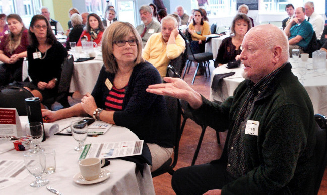 Steve Keaton, of China, a supporter of the Question 4 minimum wage increase, makes a point while asking questions of speakers Thursday during a Mid-Maine Chamber of Commerce discussion in Waterville.