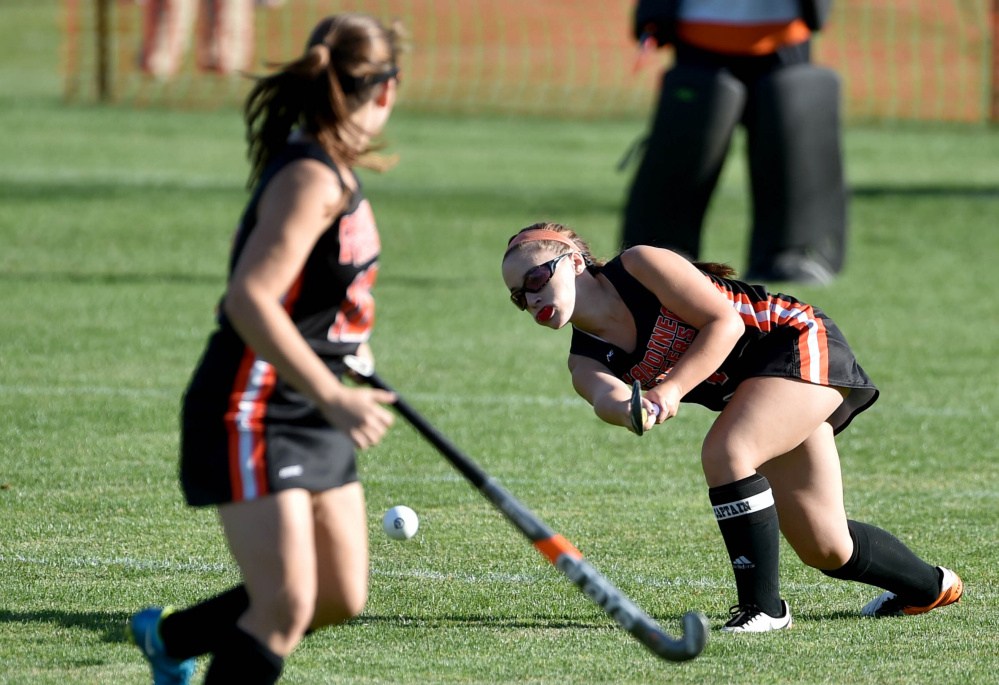 Staff photo by Michael G. Seamans
Gardiner captain Kalee Michaud passes the ball forward to teammate Jillian Bisson, left, in the first half of a game against Maine Central Institute in Pittsfield earlier this season.