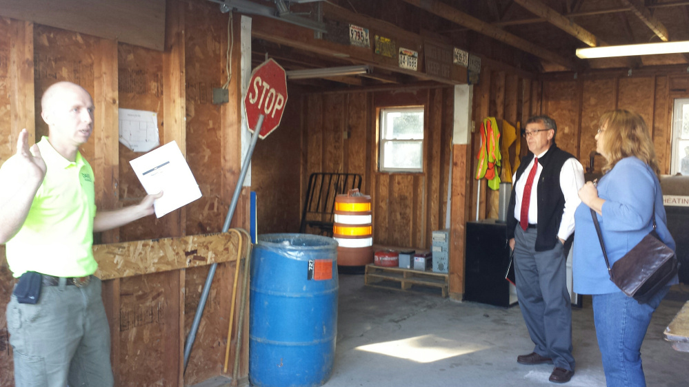 Oakland Transfer Station manager Daniel Hapgood, left, talks to the committee about his idea for a garage currently just being used for storage. Town Manager Gary Bowman listens off to the side.