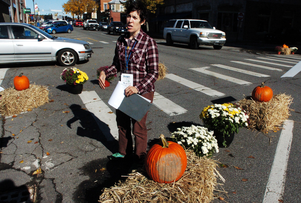 Samantha Herr, of the Bicycle Coalition of Maine, speaks about improving visibility in crosswalks for pedestrians and cyclists during a demonstration Wednesday on Main Street in Waterville. The coalition is partnering with GrowSmart Maine to illustrate challenges to people trying to navigate busy urban sections of cities.