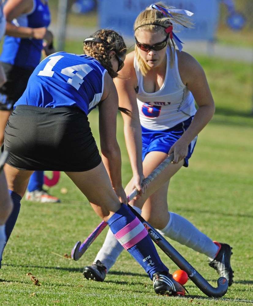 Mountain Valley's Makayla Burgess tries to stop Oak Hill's Mercedes Pierce during a Class C South quarterfinal game Wednesday at the Carrie Ricker School in Litchfield.