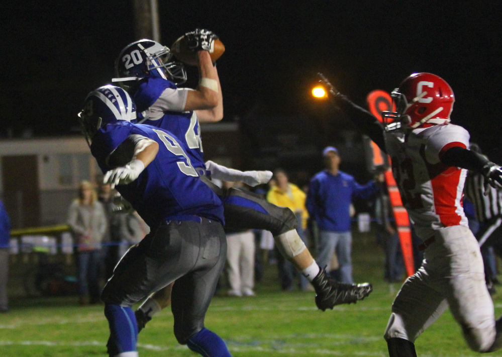 Lawrence receiver Devon Webb makes a leaping touchdown grab over Cony defender Michael Wozniak, right, during the first half of a Pine Tree Conference Class B game earlier this season.