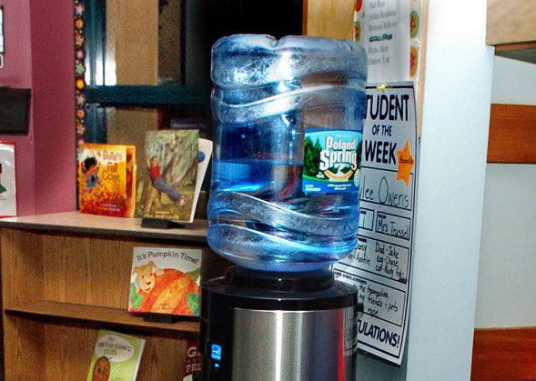 Benton Elementary School students and staff now drink only bottled water such as what is in this cooler outside a classroom since high levels of lead were detected in the building's water pipes recently. More tests are being conducted this week.