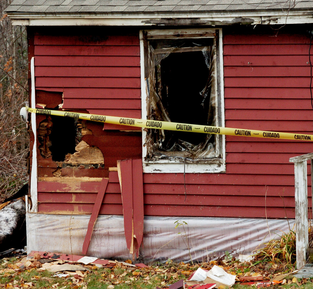 Staff photo by David Leaming
Walls and windows were left open and burned out at this home at 549 Troy Road in Detroit that was destroyed by fire on Tuesday.