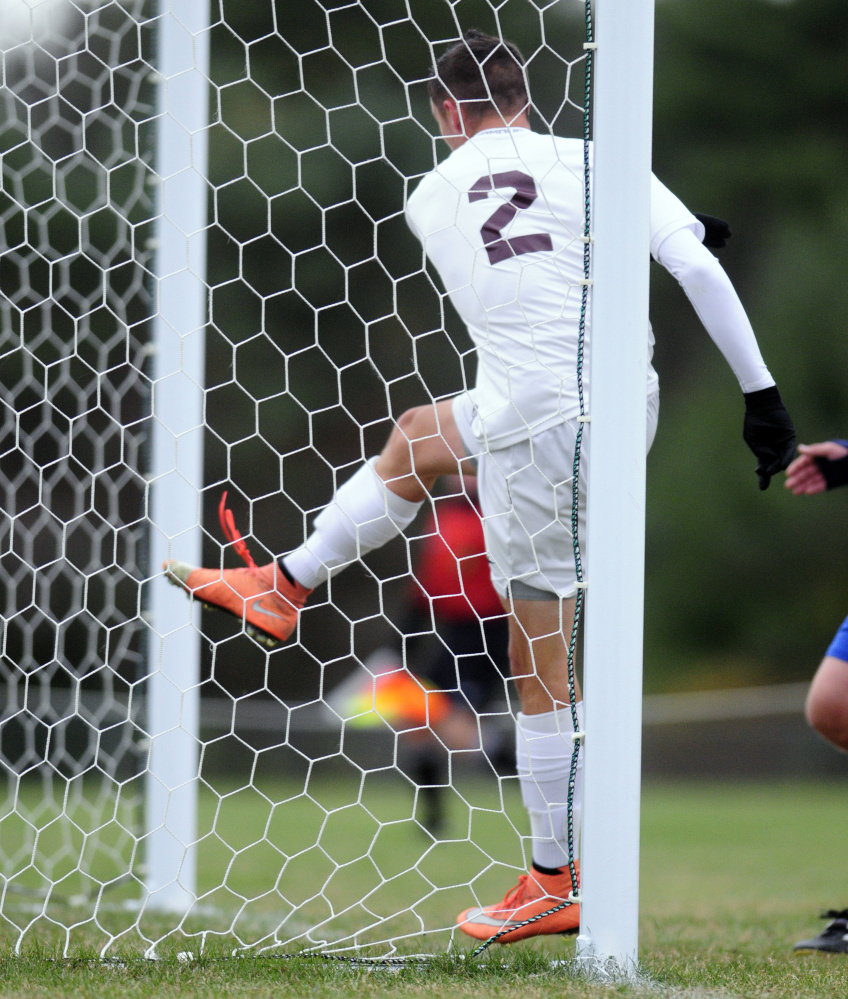 Richmond's Matt Rines follows through on scoring a goal against Islesboro during a Class D South semifinal game Thursday in Richmond. Rines' goal came on assist from Justin Vachon and put Bobcats up 2-0.