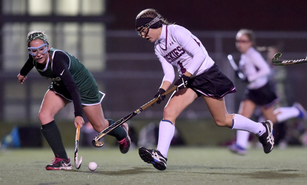 Staff file photo by Michael G. Seamans 
 Maine Central Institute's Madisyn Hartley (1) and Winthrop High School's Hanna Caprara, left, race to the ball during the Class C North final Wednesday in Hampden.