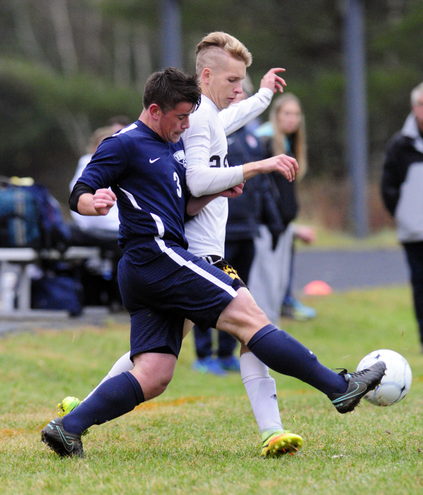 York's Keenan Gamache, left, and Maranacook's Thomas Dupay fight for a ball during a Class B South semifinal Saturday in Readfield.