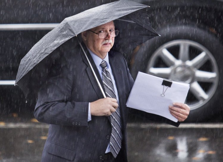 Ricky Plummer, former Old Orchard Beach fire chief, leaves the York County Courthouse after pleading not guilty Thursday to setting a fire in April that burned a large area of marshland between Old Orchard Beach and Scarborough.