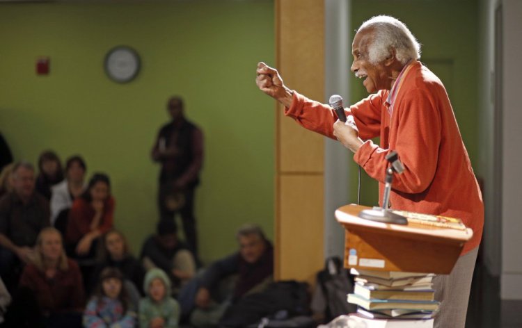 Author-illustrator Ashley Bryan speaks Saturday at the Portland Public Library. In his new children's book, "Freedom Over Me," Bryan tackles the topic of slavery.