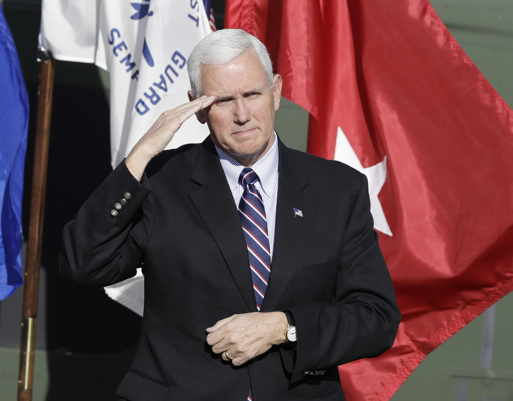 Vice President-elect Mike Pence, shown saluting veterans during a Veterans Day ceremony Friday at Camp Atterbury in Edinburgh, Ind., is heading Donald Trump's transition team.