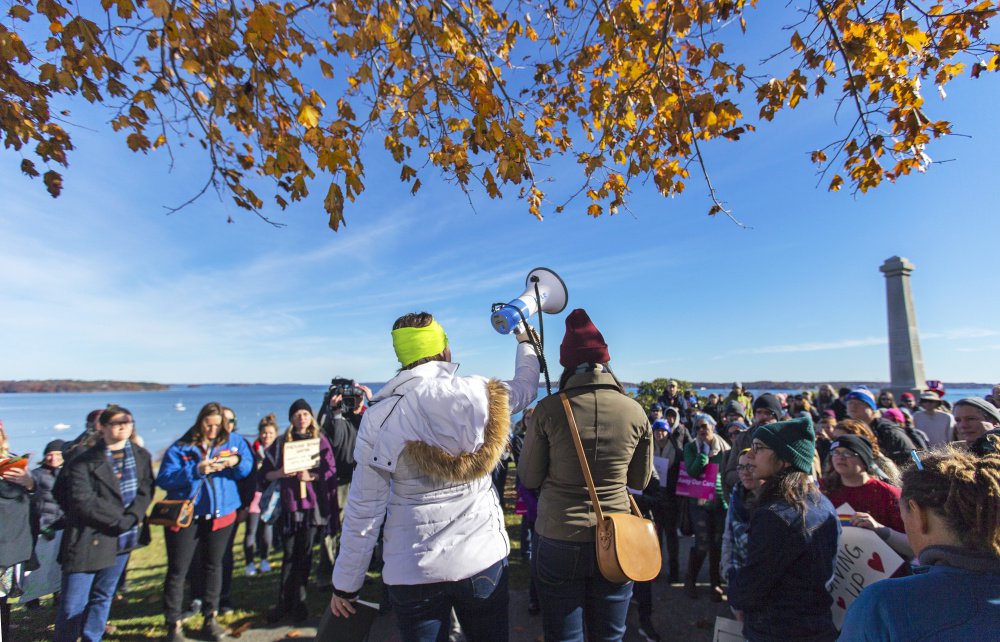 PORTLAND, ME - NOVEMBER 12: Melissa Kenison, center left, and Chelsea Ellis use a megaphone to organzie hundreds of protesters in a march from Eastern to Western Promenade to protest President-Elect Donald Trump. (Photo by Ben McCanna/Staff Photographer)