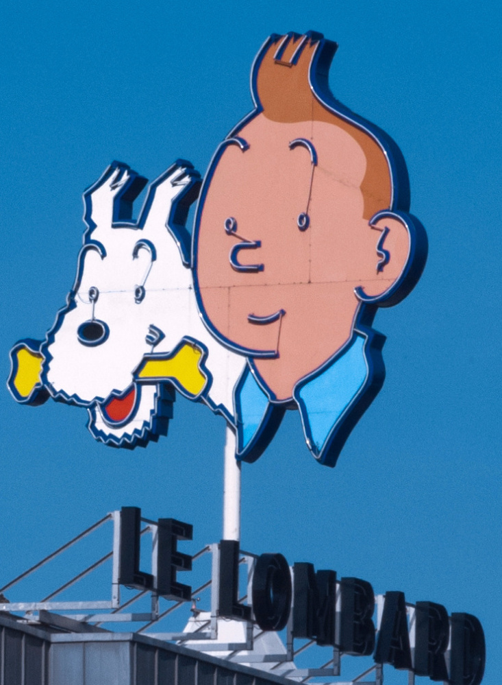 A depiction of comic-book reporter Tintin and his white dog, Snowy, tops a building in Brussels. A drawing from the comic book "Explorers on the Moon" fetched $1.64 million at auction Saturday, a record for a single cartoon drawing.
Associated Press/Geert Vanden Wijngaert