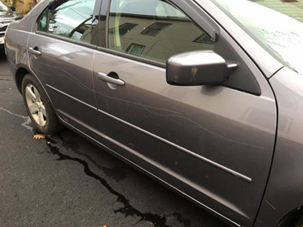 Deep scratches run along the passenger side of Megan Dyke's car.