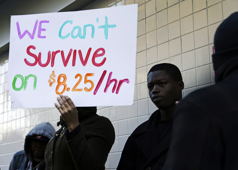 Protesters demonstrate outside a McDonald's restaurant in Oakland, Calif. A federal court on Tuesday blocked implementation of a new overtime rule.