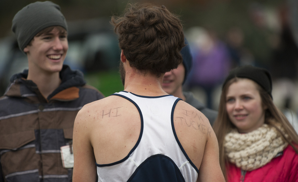 Tucker Barber, of Mt. Blue, talks with friends after winning the Class A North boys championship last weekend in Belfast.