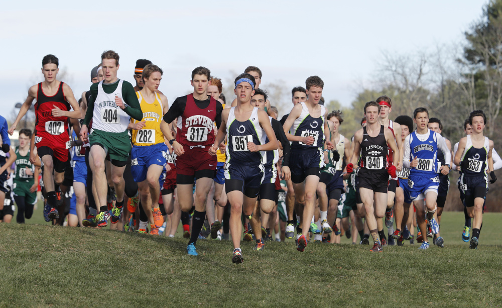 Portland Press Herald Photo by Joel Page
Runners, including Winthrop's Jacob Hickey (404), head up the hill after leaving the start of the Class C boys state championships Saturday in Belfast.