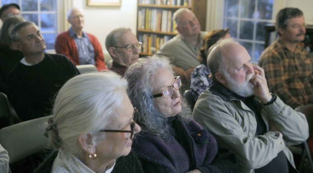 Attending a lecture Sunday at Cary Memorial Library in Wayne, people listen to Lloyd Irland discuss his military service in Vietnam The forest economist and Wayne resident served as an enlisted artillery solder from 1968 to 1970.