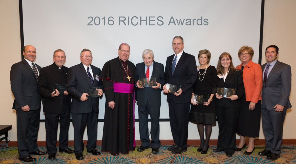 Nearly 200 attendees gathered to mark Catholic Charities Maine's 50th Anniversary on Nov. 9 and to honor the outstanding individuals, businesses, faith-based and community organizations that have worked to build a better, stronger community at the Agency's inaugural RICHES Awards Dinner. From left are Stephen Letourneau, Catholic Charities Maine CEO; the Rev. Frank Morin, St. Michael's Parish; Larry Lachance; Bishop Robert P. Deeley; Neil Michaud; Timothy Crowley, president of Northern Maine Community College; Nancy Pierce;  Gemma Cannon, HealthInfoNet; Sr. Donna Markham, president of CCUSA; and David Madore, Catholic Charities Maine Board Chairman.