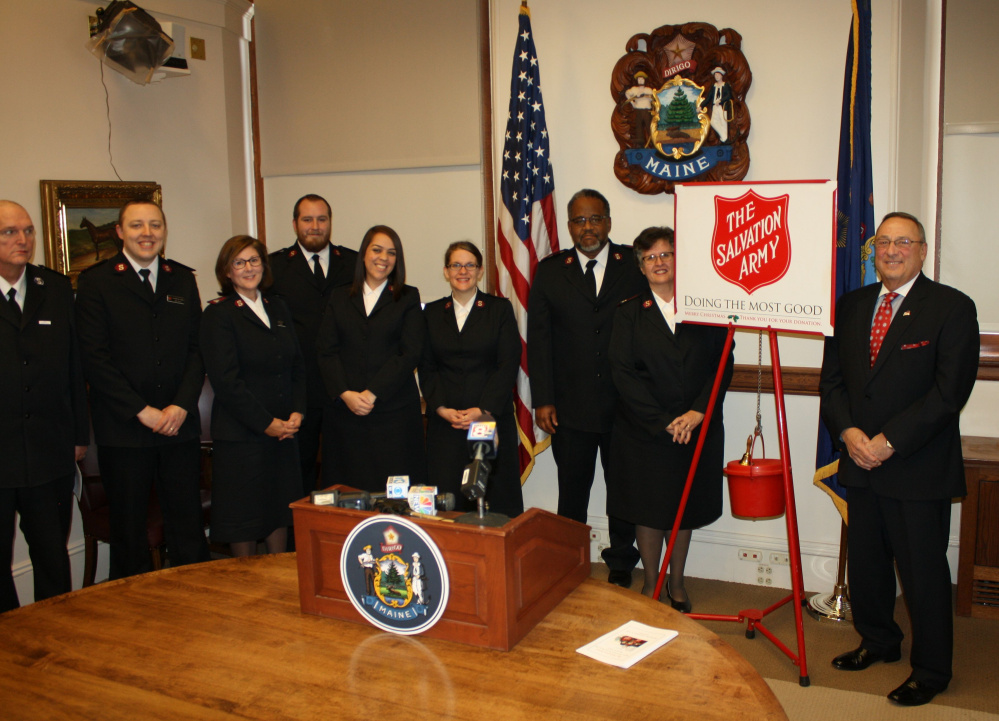 From left, are Don Walsh, Emergency Disaster Services coordinator; Lt. Daniel Johnson, of Lewiston; Maj. Annette Lock, of Portland; Lt. Dominic Nicoll, of Houlton; Lt. Anagelys Cruz, of Augusta; Lt. Railene Griffin, of Sanford; Majors Raphael and Sandra Jackson, divisional leaders; and Gov. Paul R. LePage.