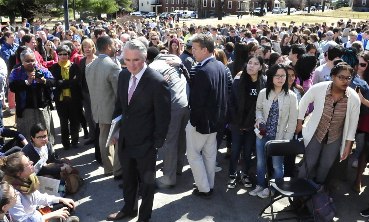 Colby College President David Greene, center, makes his way through more than 500 students and staff members on April 16, 2015, at the Waterville campus to speak during a forum on racial issues.