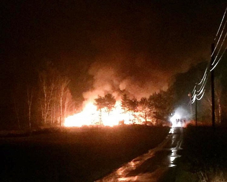 Flames engulf a barn on Susan Lane, West Gardiner, on Tuesday night. The barn, which belonged to George Tomberlin, was destroyed.