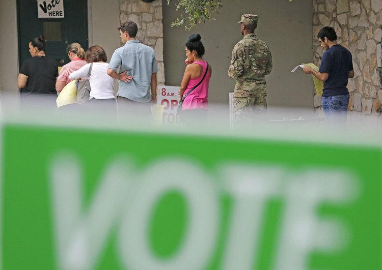 Voters wait in line to cast ballots at an early polling site in San Antonio, Texas, on Nov. 4.  Thanks to early voting, more than 50 million people may have voted before Election Day. <em>Associated Press/Eric Gay</em>