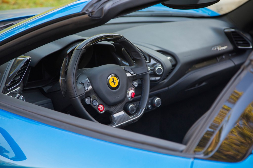 The 2017 Ferrari 488 Spider is powered by a 3.9-liter turbo charged V8 engine that produces 670 horsepower and 560 pound feet of torque. It goes from 0-60mph in under 3 seconds. 