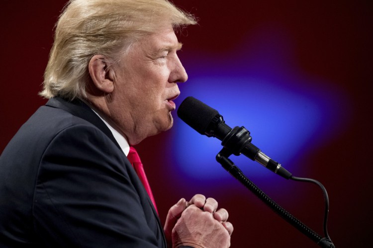 President-elect Donald Trump speaks at a rally at Hy-Vee Hall Thursday in Des Moines, Iowa.