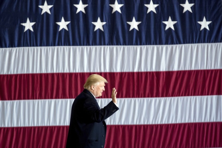 President-elect Donald Trump arrives for a rally at Baton Rouge Metropolitan Airport on Friday in Baton Rouge, La. Trump has consistently dismissed the intelligence community's findings about Russian hacking.