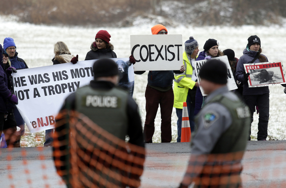 Protesters gather last Monday on the first day of the New Jersey black bear hunt at the Whittingham Wildlife Management Area in Fredon.