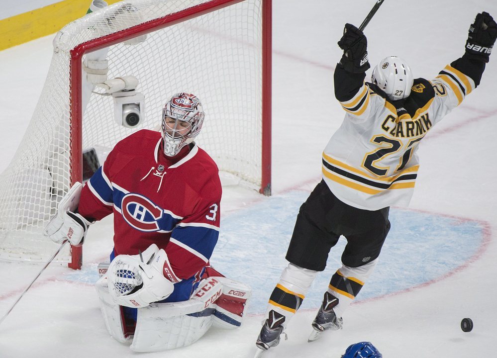 The Bruins' Austin Czarnik celebrates after scoring against Canadiens goaltender Carey Price in the second period Monday night in Montreal.