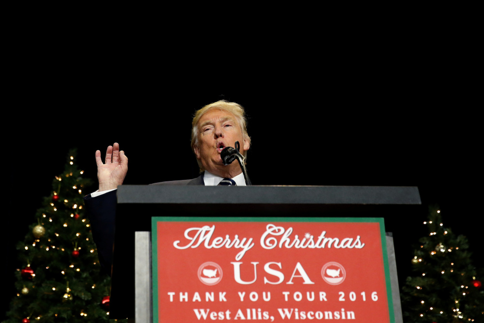 With the nation still divided over his merits, President-elect Donald Trump speaks Tuesday at the USA Thank You Tour at the Wisconsin State Fair Exposition Center in West Allis, Wisc.