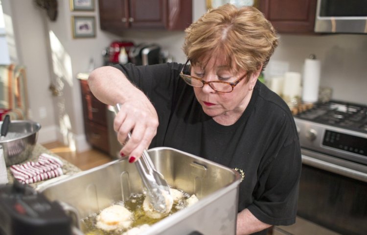 Nancy Cerny checks the progress on the battered pieces of baguette for her tried-and-true French toast. It all culminates in a crunchy exterior and soft, creamy inside.