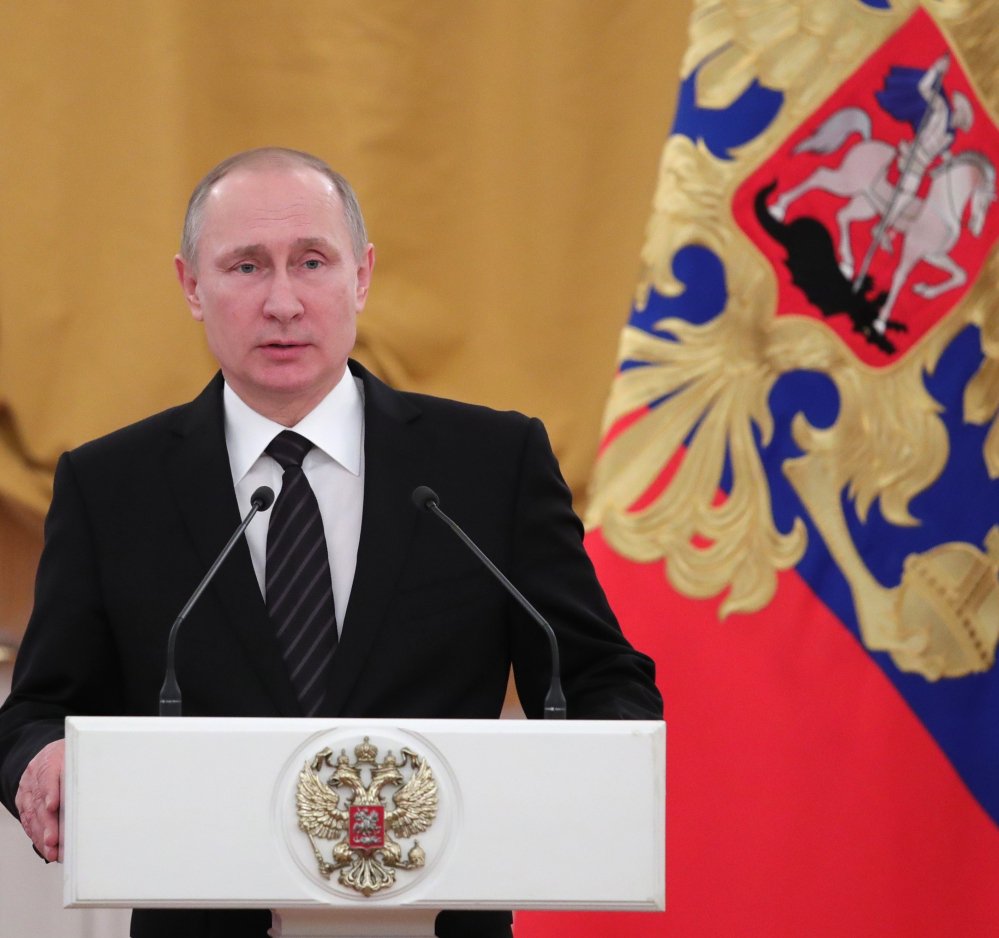 Russian President Vladimir Putin, at a New Year reception in the Kremlin in Moscow, Russia, Wednesday speaks during a New Year reception in the Kremlin in Moscow, Russia, Wednesday, Dec. 28, 2016. (Mikhail Klimentyev/Sputnik, )