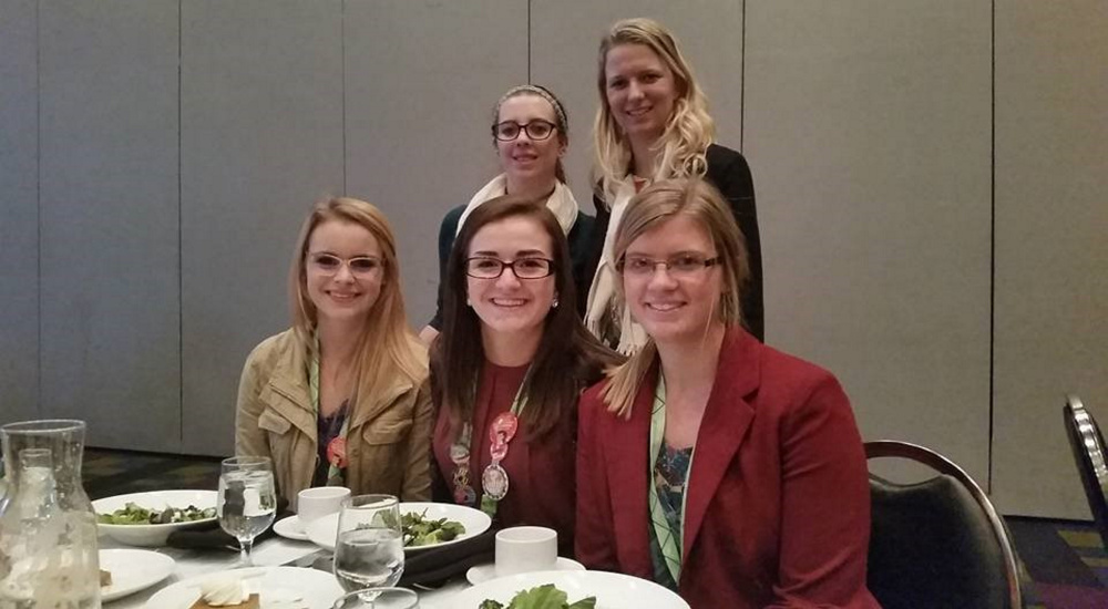 Seated, from left are Emily Lanpher, Alexandra Cotter and Savanna Kandiko. Standing is Kasey Mello, left, and Dr. Katie Rybakova.