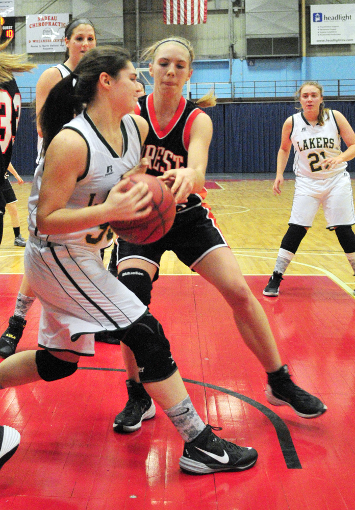 Rangeley forward Sydney Royce, left, and Forest Hills' Caitlin Logston battle for a rebound during a game last Dec. 31 in Augusta. The Lakers are coming off the Class D state championship and should be in the hunt again. Logston returns to lead a strong Forest Hills group.