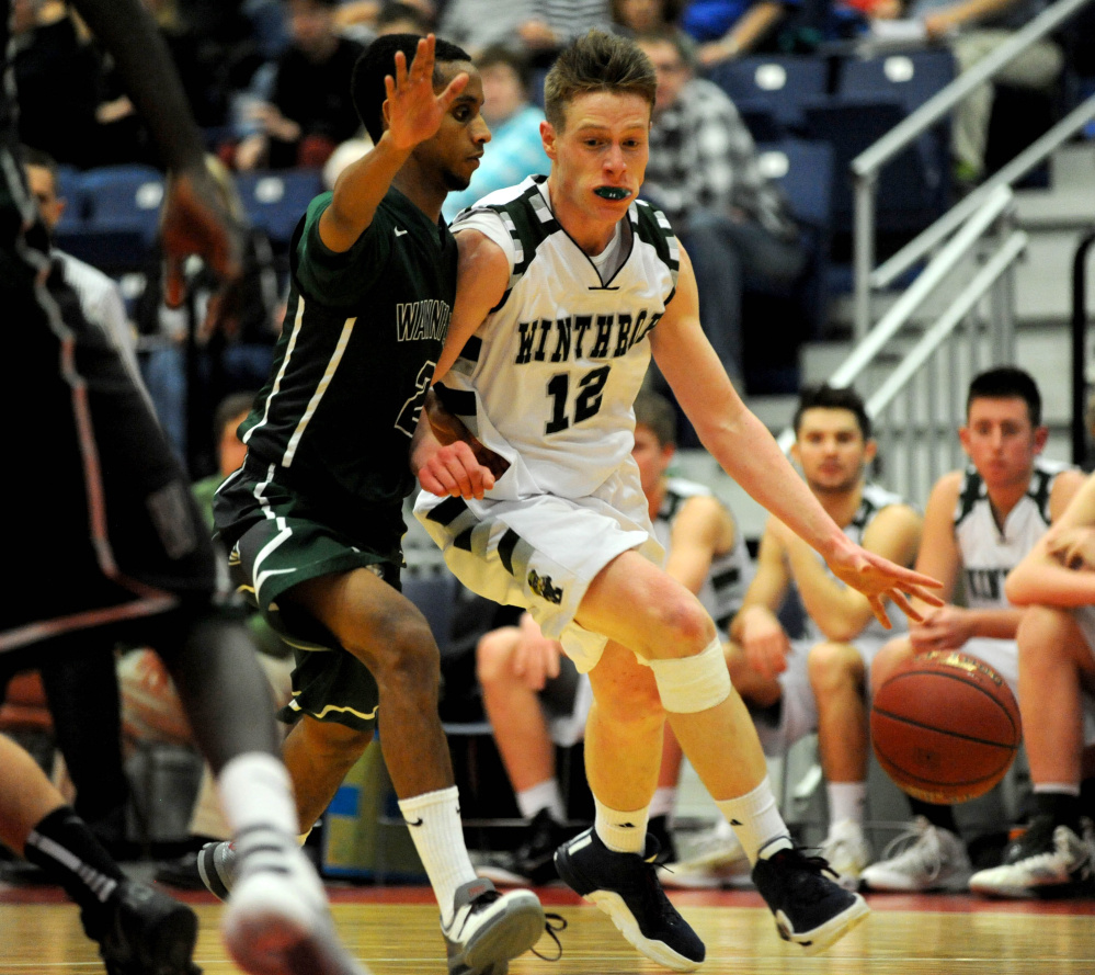 Winthrop guard Jacob Hickey, right, drives by Waynflete defender Abel Alemayo during the second half of the South C final last season in Augusta. Hickey and the Ramblers fell short in that game, which is all the motivation they need this winter.