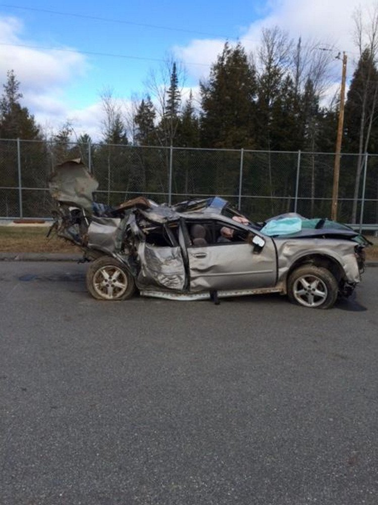 A 1998 Nissan Maxima was destroyed Nov. 13, 2015, on Anson Road in Starks after veering off the road, in a photo provided by the Somerset County Sheriff's Office.