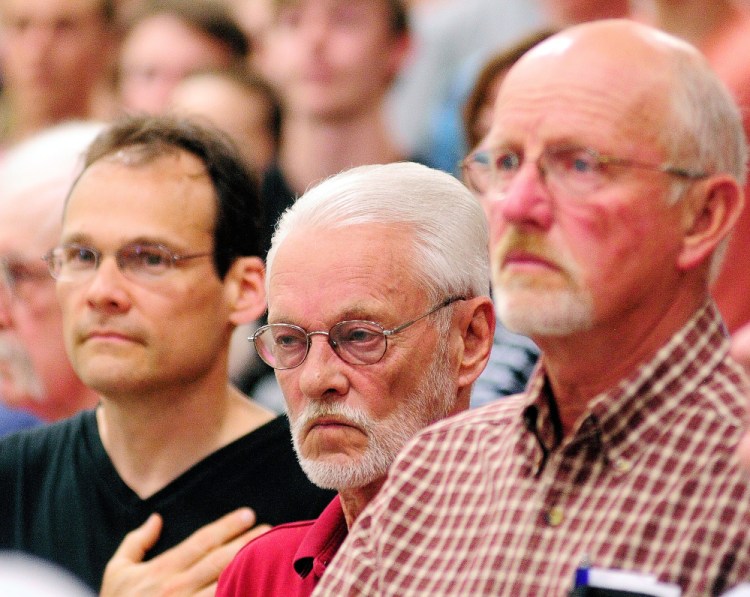 Roger Madore, left, and Bob Madore, the grandson and son of Pfc. Harvey Madore, and Ford Stevenson, nephew of Capt. Joseph Berry, attended the May 26 Memorial Day assembly at Maranacook Community School in Readfield that honored their relatives who died in action in World War II.