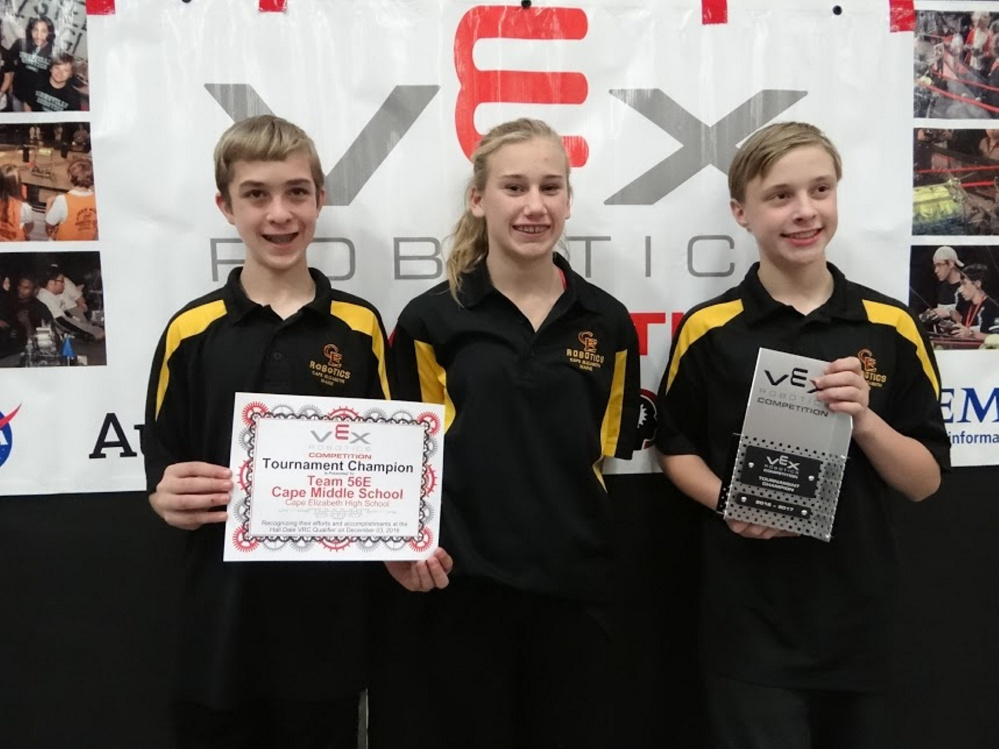 Cape Elizabeth Middle School VEX Robotics Team 56E poses with one of their trophies after winning multiple awards at Hall-Dale High School's first VEX Robotics Competition on Dec. 3.