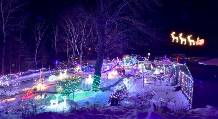 Donald Lagasse's home illuminates the night Thursday on China Road in Winslow.