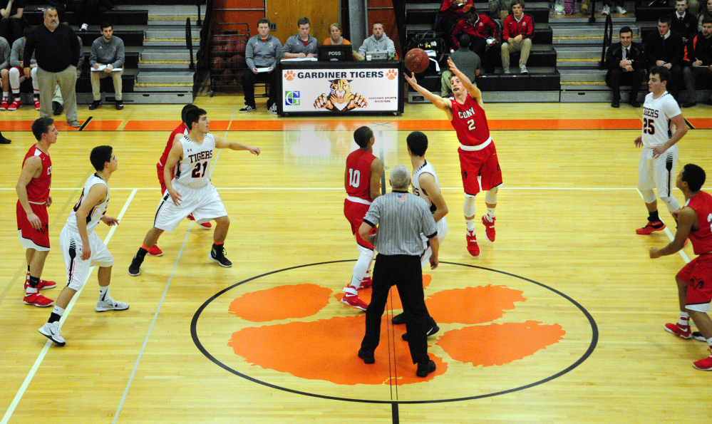 Cony's Taylor Heath grabs the ball after the tipoff to start a game against Gardiner on Thursday in Gardiner.