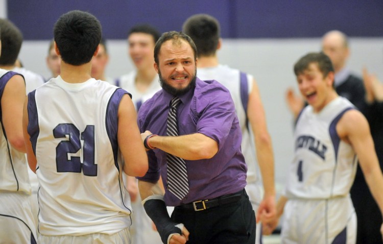 Former Waterville boys basketball coach Wade Morrill, center, now the head coach at Monmouth Academy, is one of many area coaches who was influenced by his time at the University of Maine at Farmington.