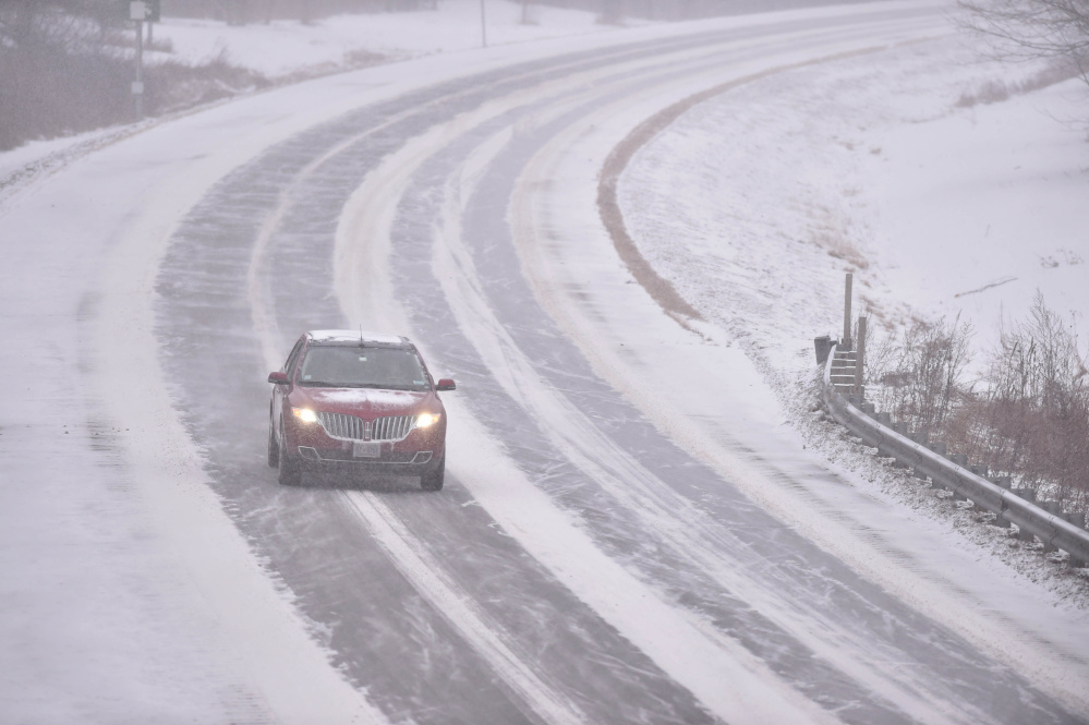 Traffic slows to 45 mph on the north lane of Interstate 95 in Waterville on Thursday as a Nor'easter hits the region.